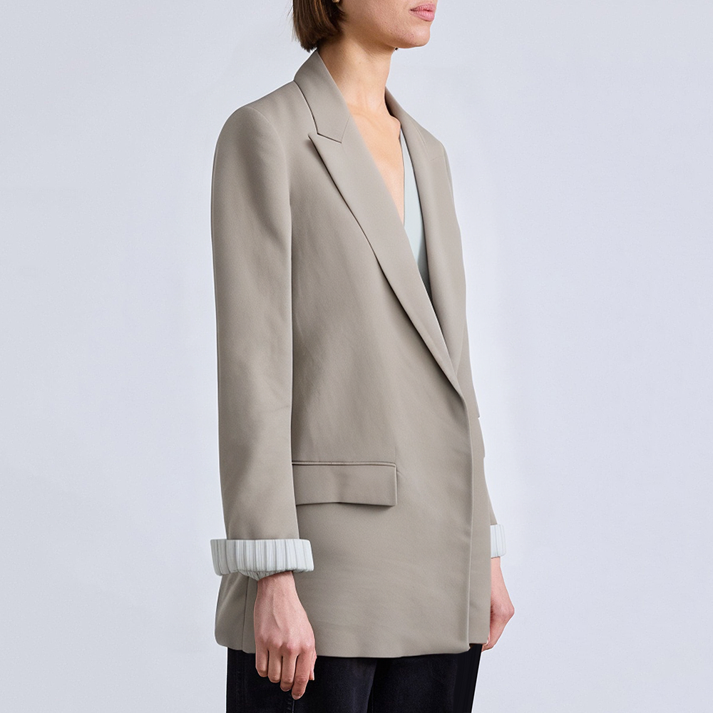 Women's suit jacket with padded shoulders and rolled sleeves